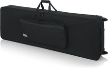 Load image into Gallery viewer, Gator Cases GK-76 Lightweight Keyboard Case with Pull Handle and Wheels; Fits 76-Note Keyboards