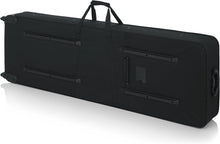 Load image into Gallery viewer, Gator Cases GK-76 Lightweight Keyboard Case with Pull Handle and Wheels; Fits 76-Note Keyboards